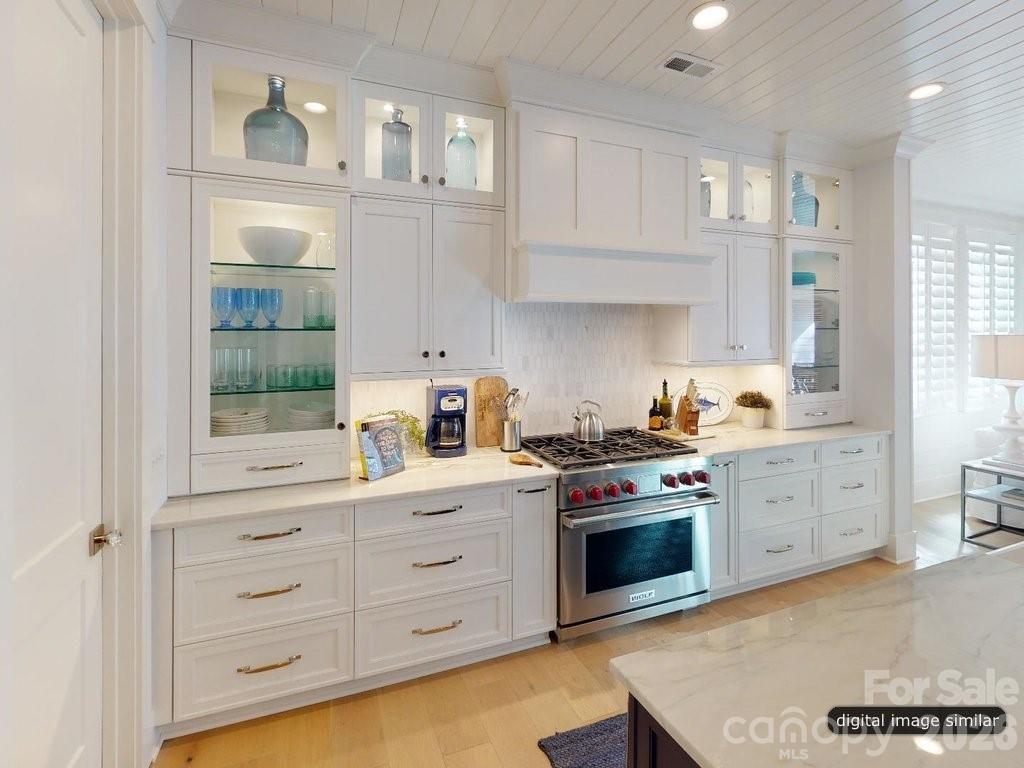 134 Willow Vw Loop, Unit 1 Davidson, NC 28036 - Photo 14 of 42 a kitchen with white cabinets and appliances