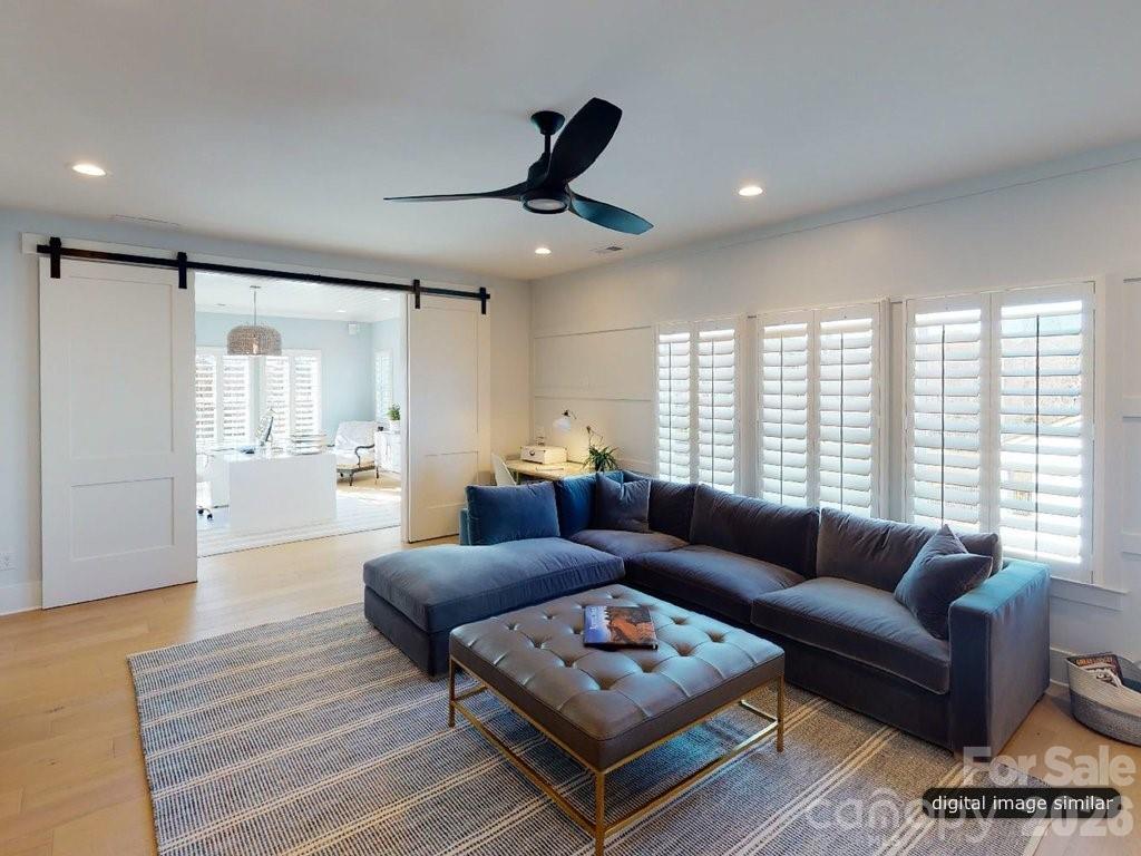 134 Willow Vw Loop, Unit 1 Davidson, NC 28036 - Photo 26 of 42 a living room with furniture and a large window
