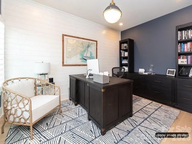 a living room with a couch and a bookshelf