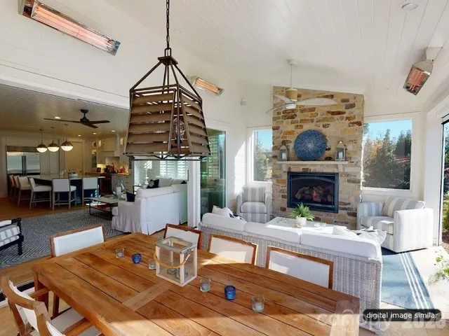 a living room with fireplace furniture and a fireplace