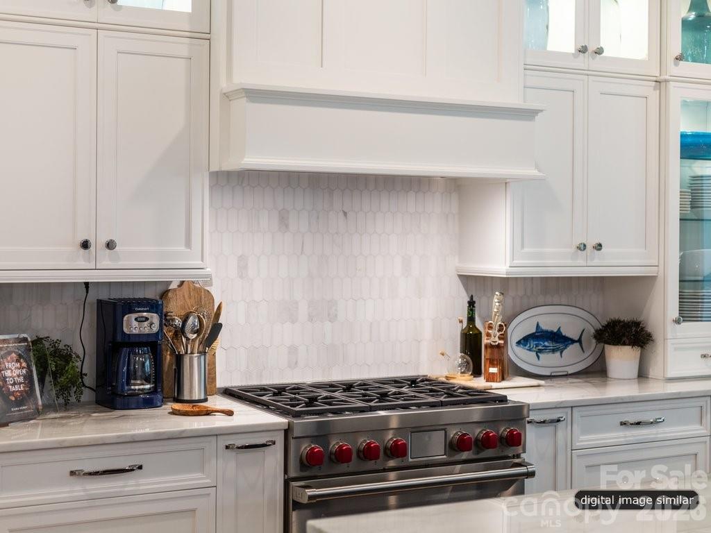 134 Willow Vw Loop, Unit 1 Davidson, NC 28036 - Photo 6 of 42 a kitchen with a stove and wooden floor