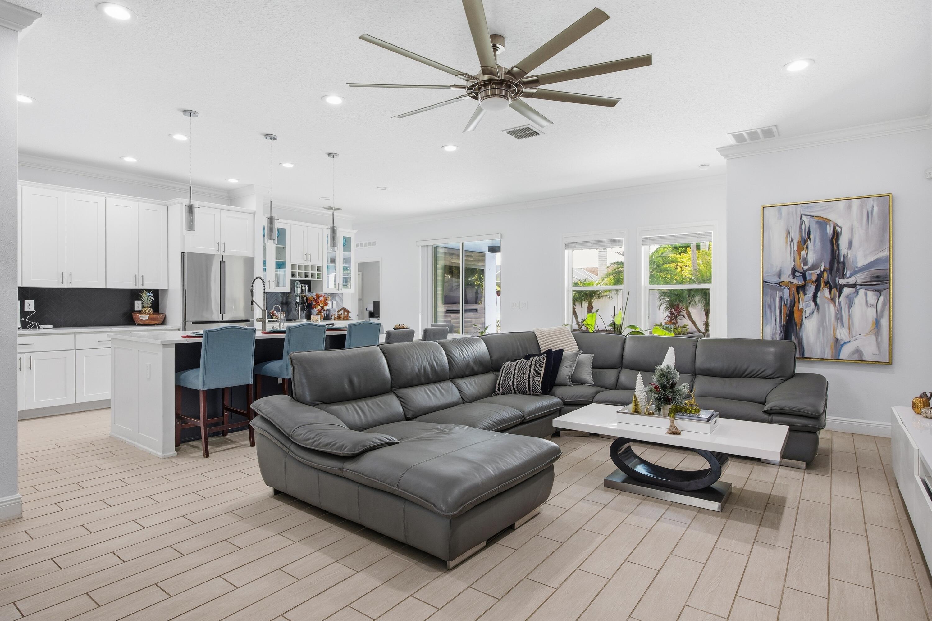 2758 Southwest Onaway Avenue Port St. Lucie, FL 34987 - Photo 13 of 49 a living room with furniture and a view of kitchen