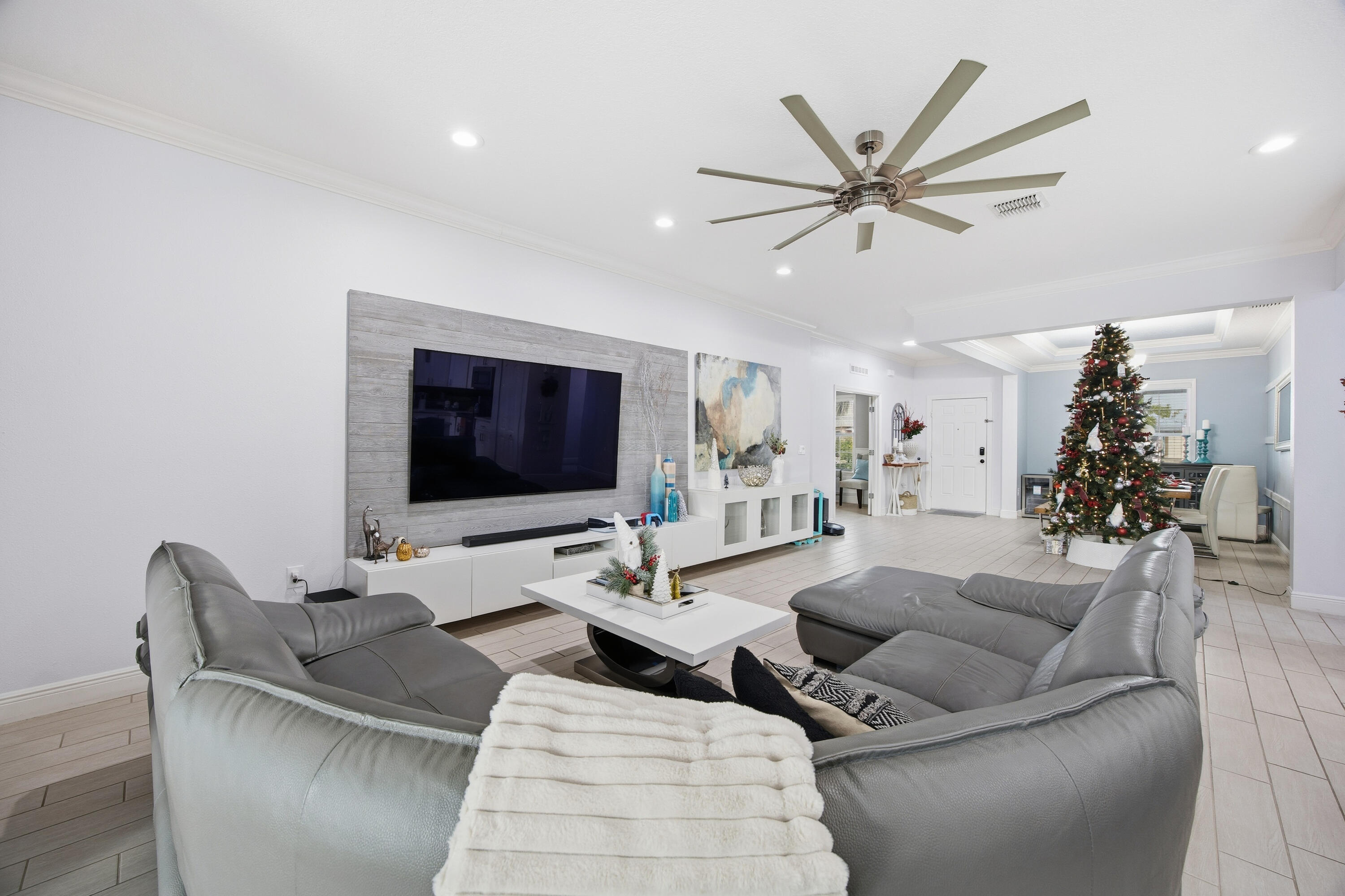 2758 Southwest Onaway Avenue Port St. Lucie, FL 34987 - Photo 14 of 49 a living room with furniture and a flat screen tv
