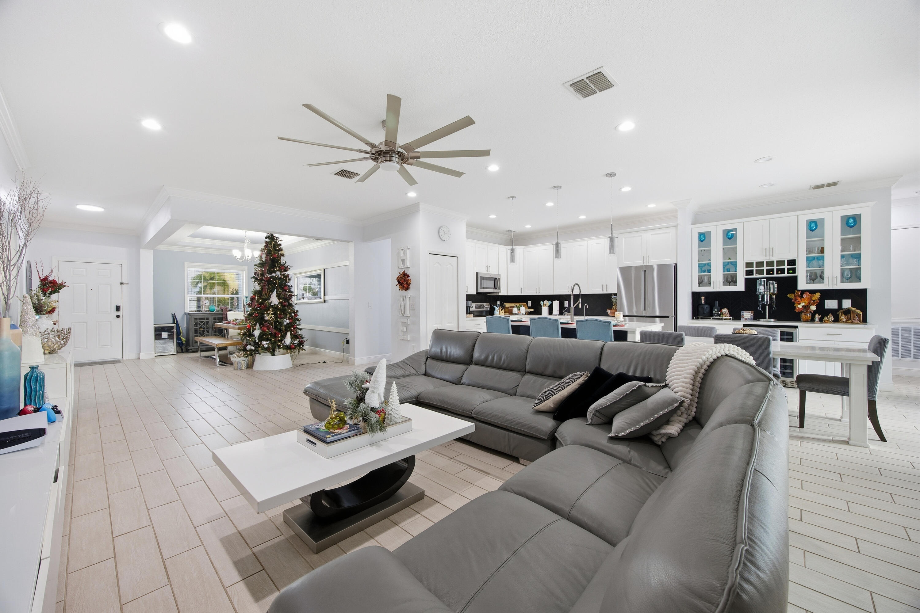 2758 Southwest Onaway Avenue Port St. Lucie, FL 34987 - Photo 15 of 49 a living room with furniture and kitchen view