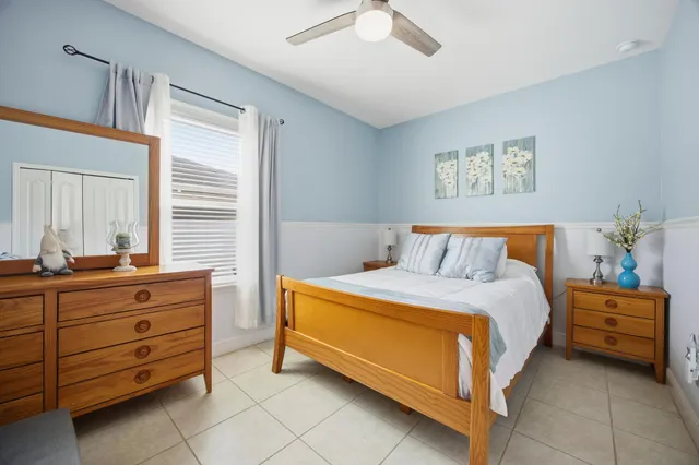 a bedroom with a bed and a dresser