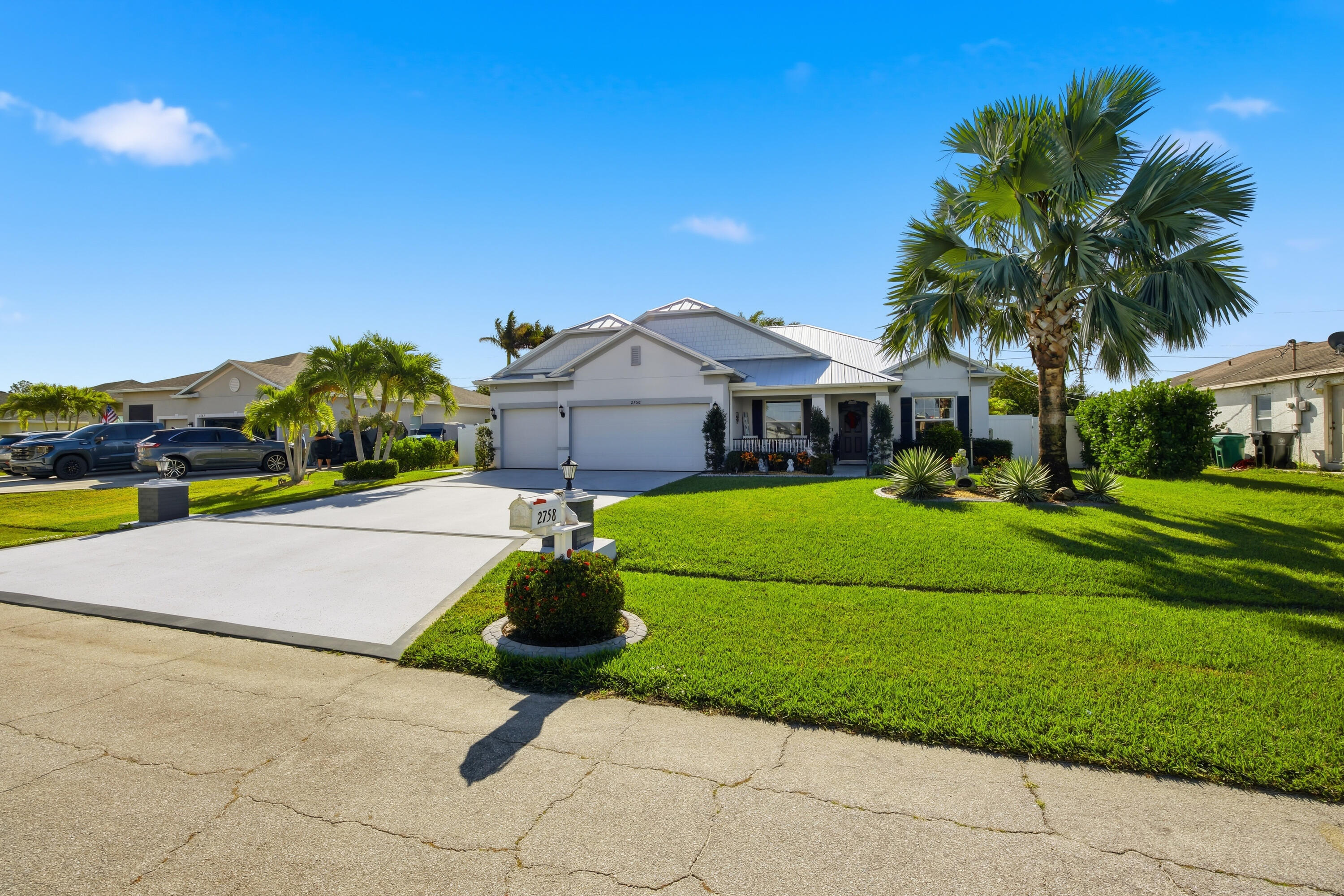 2758 Southwest Onaway Avenue Port St. Lucie, FL 34987 - Photo 3 of 49 a house view with a garden space