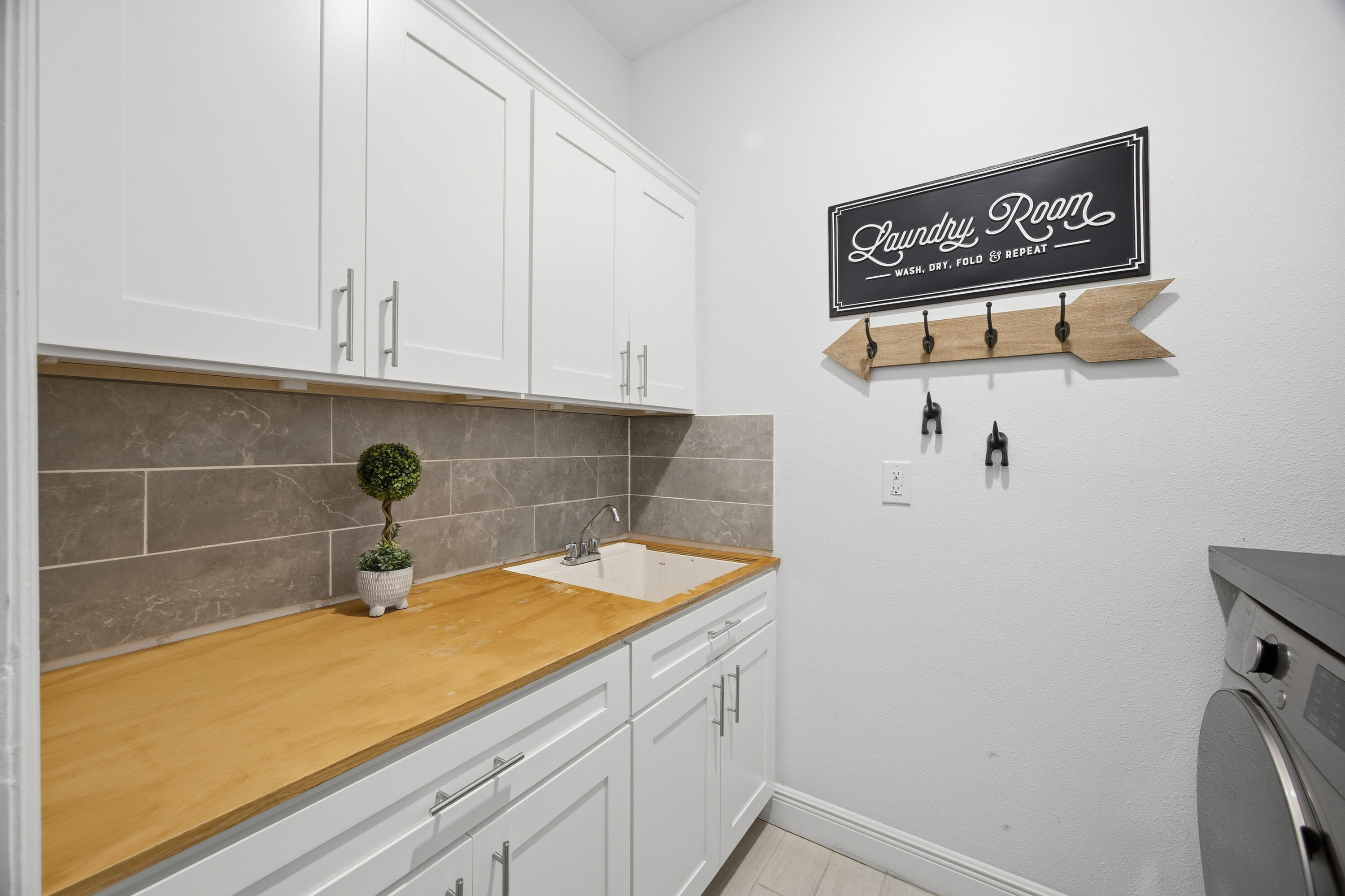 2758 Southwest Onaway Avenue Port St. Lucie, FL 34987 - Photo 32 of 49 a room with storage and utility