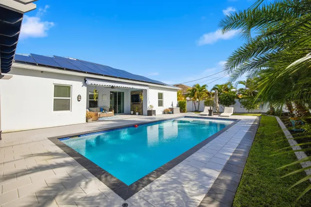 a view of a house with swimming pool
