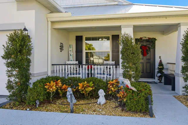 a view of a porch with a flower garden