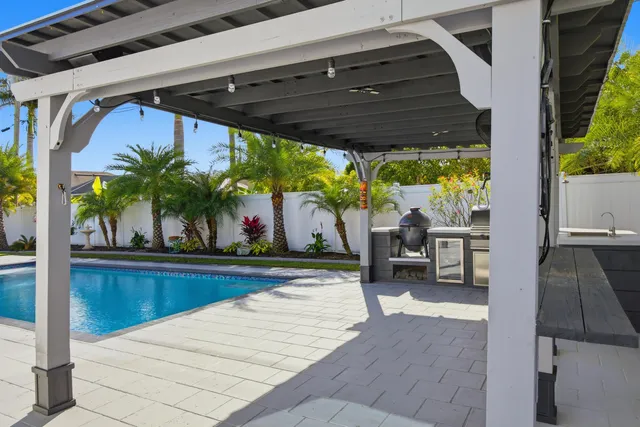 a view of swimming pool with outdoor seating