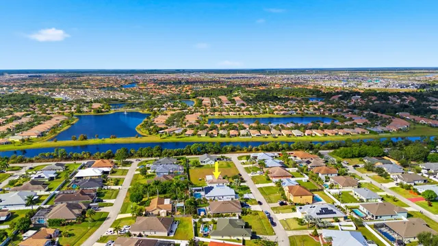 an aerial view of residential building and ocean