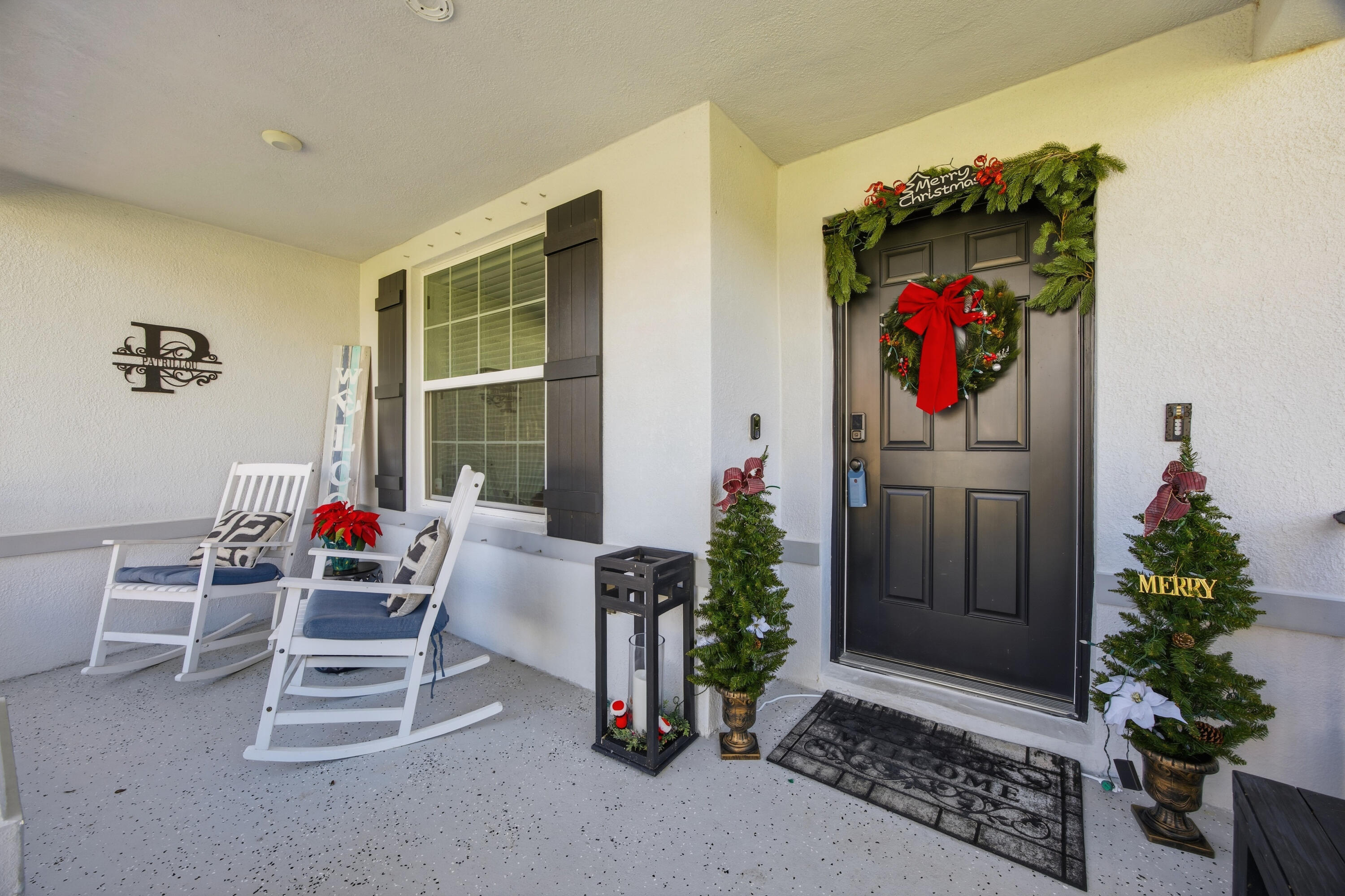 2758 Southwest Onaway Avenue Port St. Lucie, FL 34987 - Photo 5 of 49 a living room with furniture and a potted plant