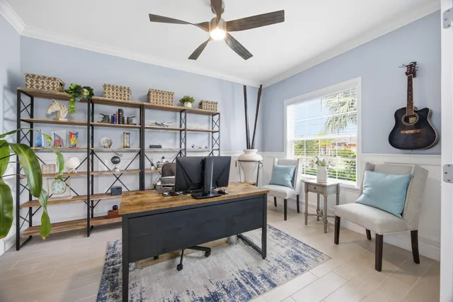 a living room with furniture a rug and a window