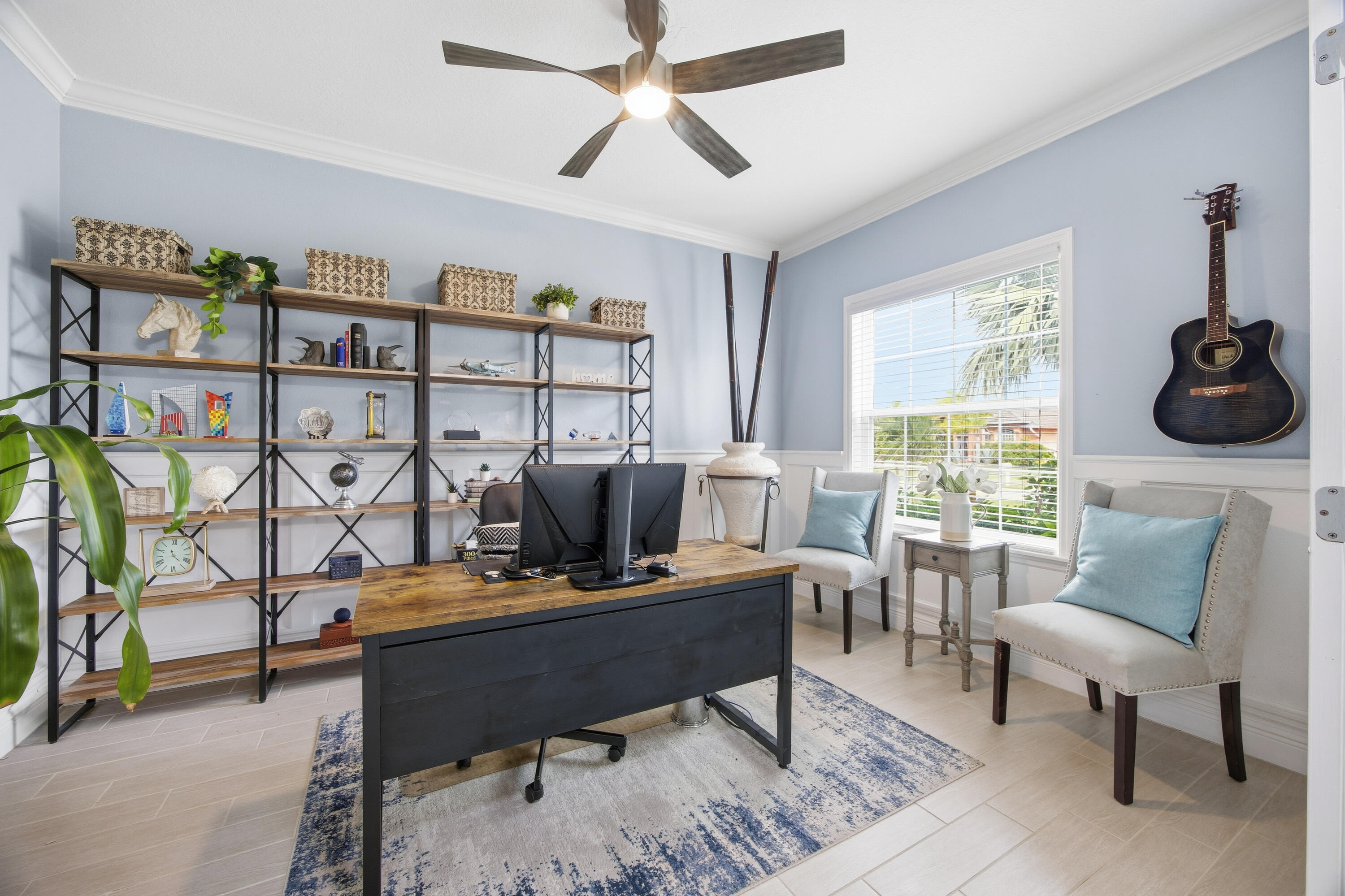 2758 Southwest Onaway Avenue Port St. Lucie, FL 34987 - Photo 7 of 49 a living room with furniture a rug and a window