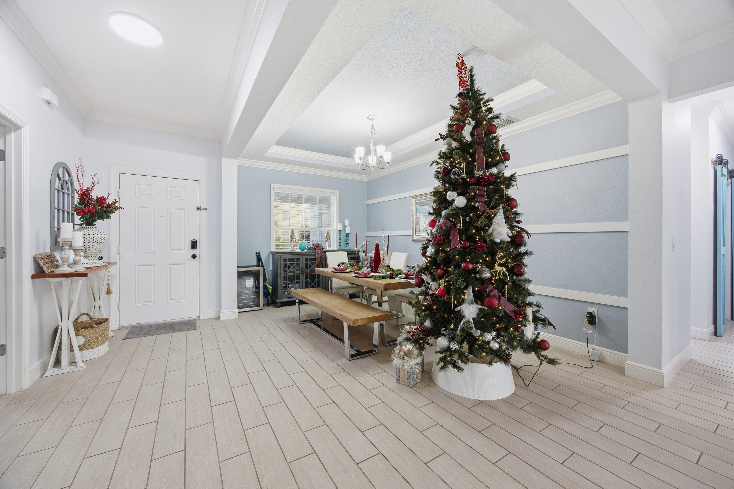 2758 Southwest Onaway Avenue Port St. Lucie, FL 34987 - Photo 10 of 49 a living room with furniture and a potted plant