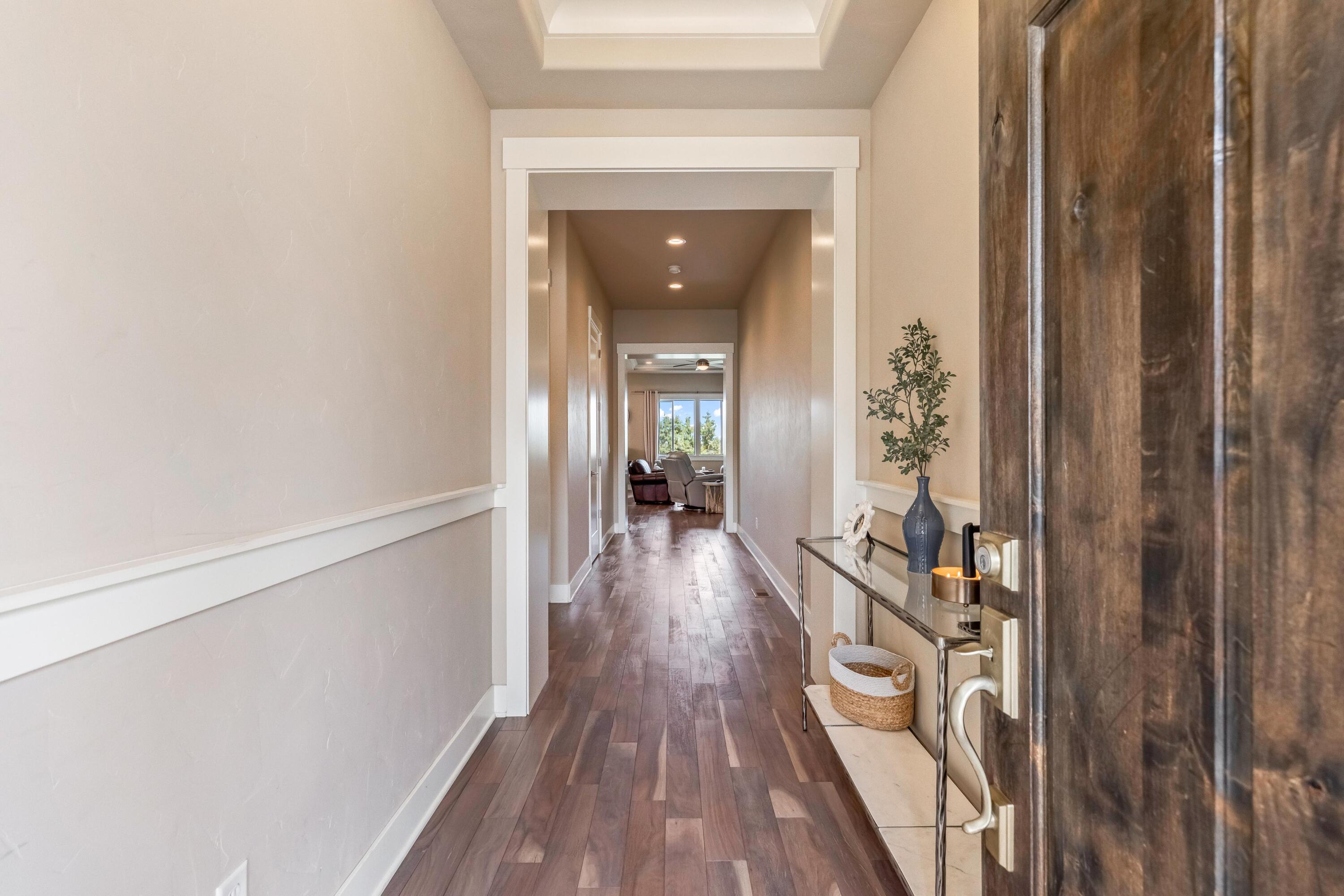 2375 Northwest Majestic Ridge Drive Bend, OR 97703 - Photo 21 of 28 a view of a hallway view with wooden floor and staircase