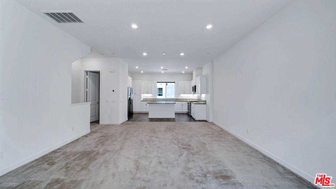 27009 Hummingbird Lane Valencia, CA 91381 - Photo 12 of 35 a view of an empty room with kitchen