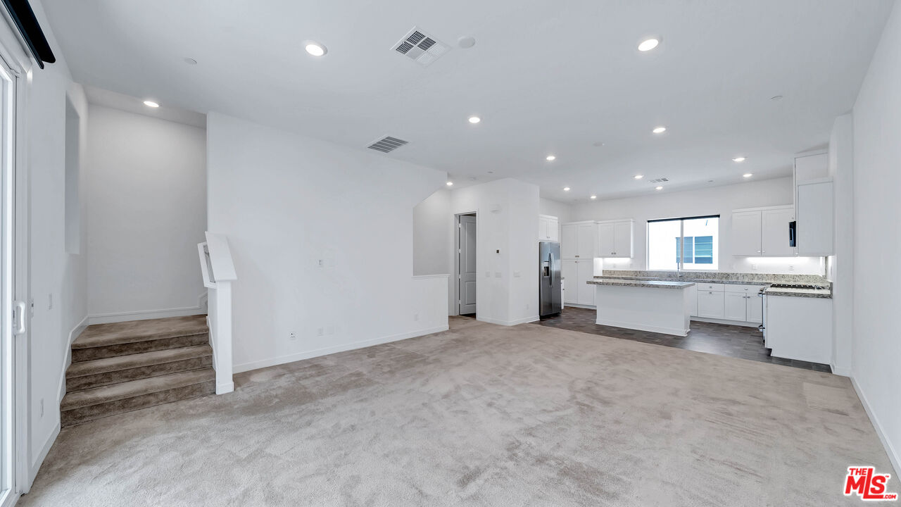 27009 Hummingbird Lane Valencia, CA 91381 - Photo 13 of 35 a view of an empty room with a kitchen