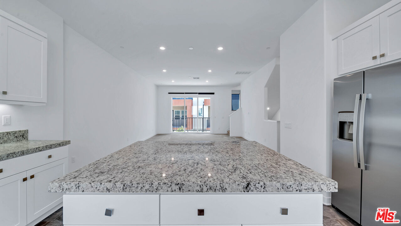 27009 Hummingbird Lane Valencia, CA 91381 - Photo 17 of 35 a view of kitchen island