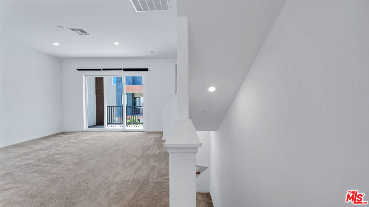 27009 Hummingbird Lane Valencia, CA 91381 - Photo 20 of 35 a view of an empty room and window