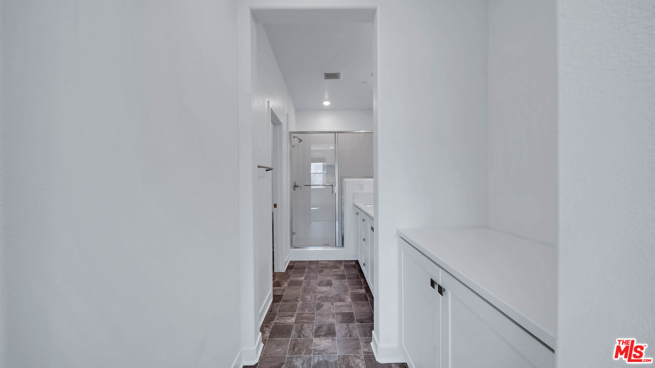 27009 Hummingbird Lane Valencia, CA 91381 - Photo 30 of 35 a bathroom with a sink and a mirror