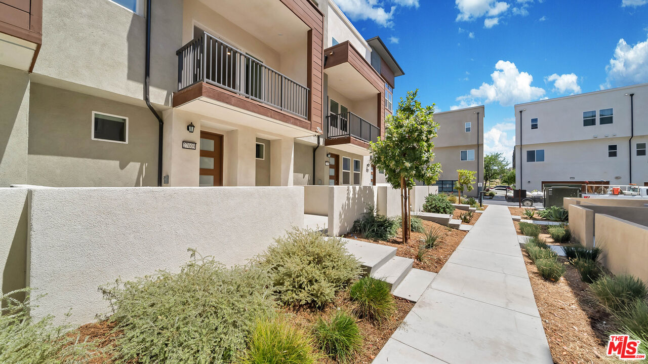 27009 Hummingbird Lane Valencia, CA 91381 - Photo 32 of 35 a view of a building with many windows
