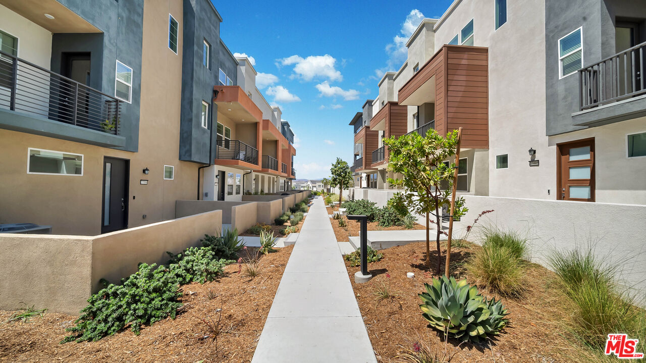 27009 Hummingbird Lane Valencia, CA 91381 - Photo 33 of 35 a view of a pathway with a white house