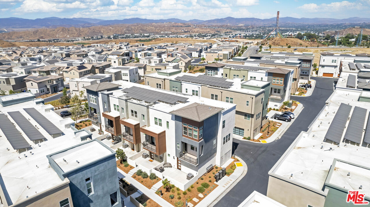 27009 Hummingbird Lane Valencia, CA 91381 - Photo 6 of 35 an aerial view of a residential apartment building with a city view