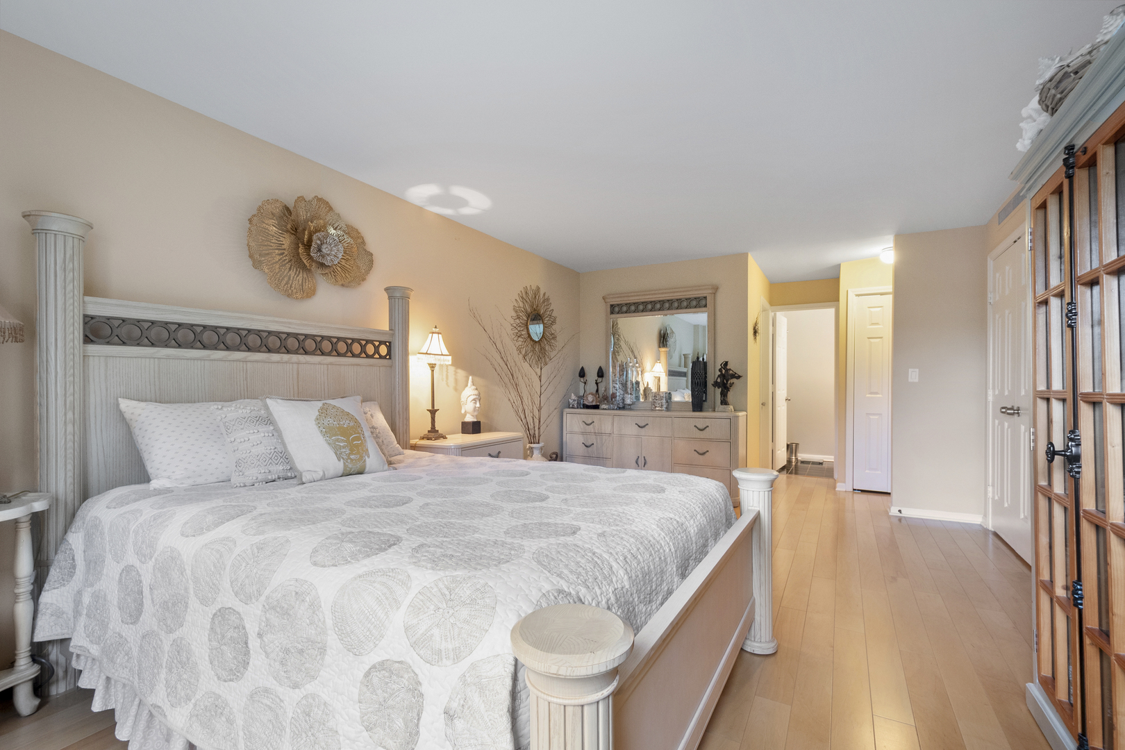 44 Park Lane, Unit 223 Park Ridge, IL 60068 - Photo 15 of 28 a bedroom with a large bed and a chandelier