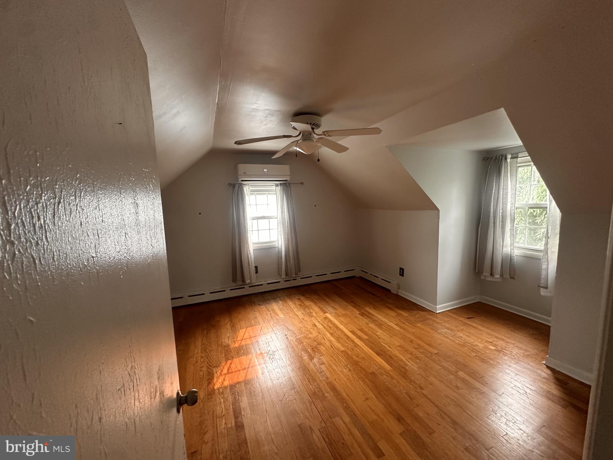 115 Murphy Road Wilmington, DE 19803 - Photo 14 of 17 an empty room with wooden floor and windows