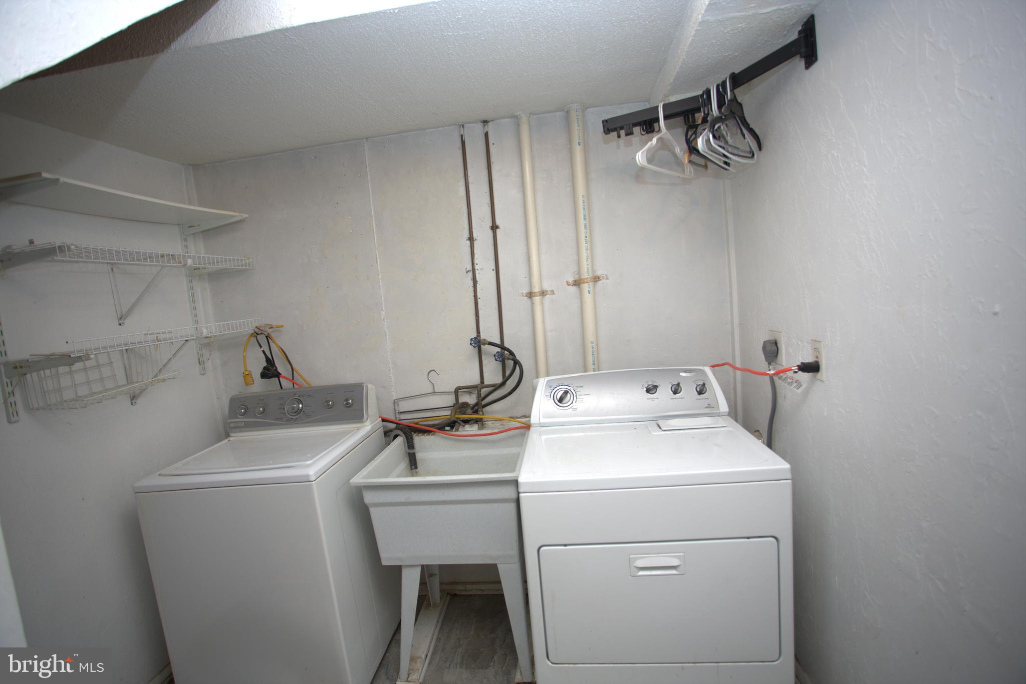 542 Chisholm Trail Lusby, MD 20657 - Photo 22 of 29 a utility room with dryer and washer