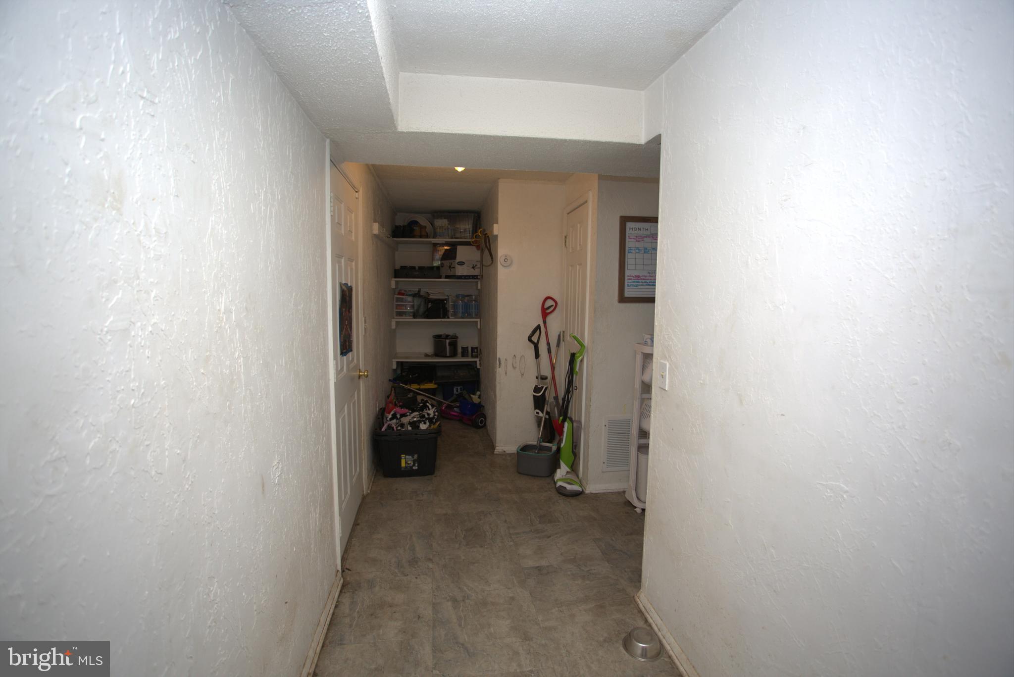 542 Chisholm Trail Lusby, MD 20657 - Photo 24 of 29 a view of walk in closet with clothes and shoes