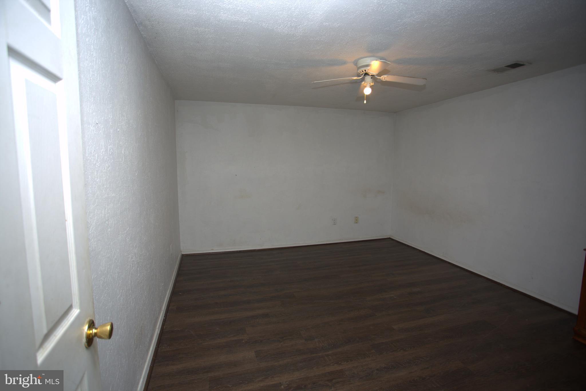 542 Chisholm Trail Lusby, MD 20657 - Photo 25 of 29 a kitchen with a sink and a potted plant
