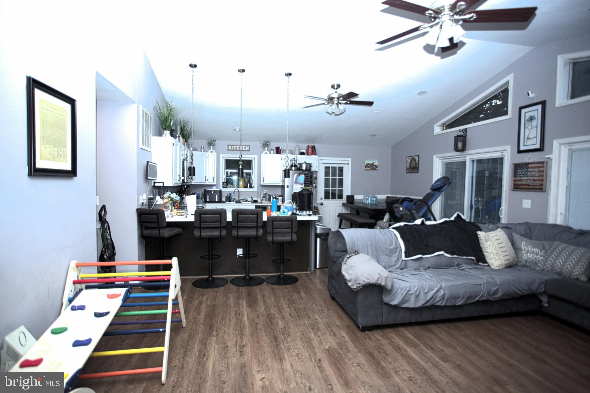 542 Chisholm Trail Lusby, MD 20657 - Photo 3 of 29 a living room with furniture and kitchen view