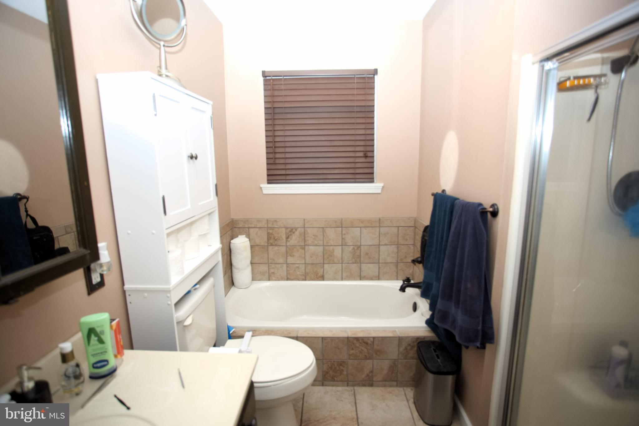 542 Chisholm Trail Lusby, MD 20657 - Photo 8 of 29 a bathroom with a bathtub and a shower