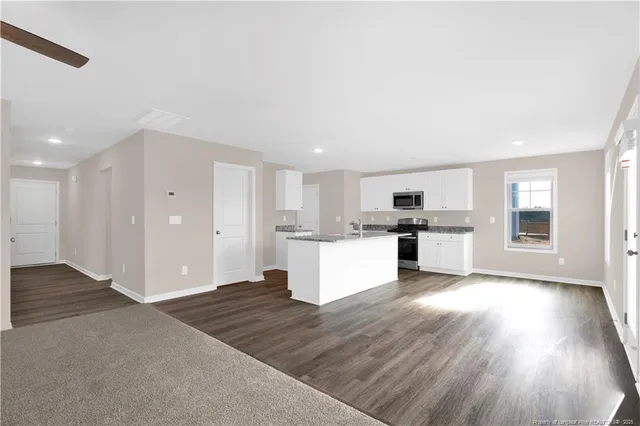 a view of kitchen with wooden floor and window