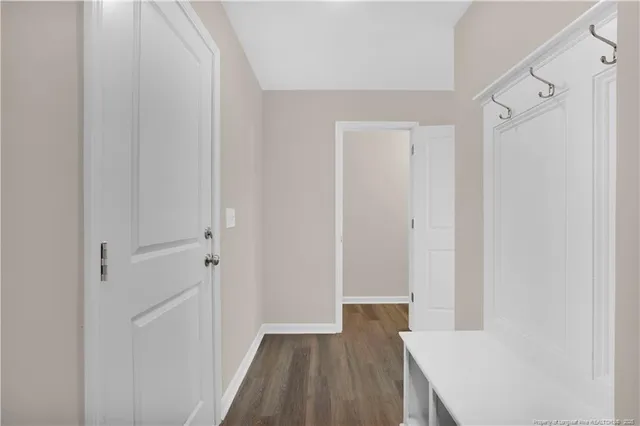 a bathroom with a granite countertop sink a toilet and a bathtub
