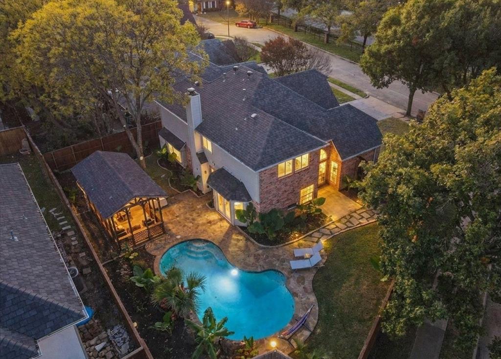 4402 Goodwin Drive Grand Prairie, TX 75052 - Photo 1 of 39 an aerial view of a house with a yard and lake view