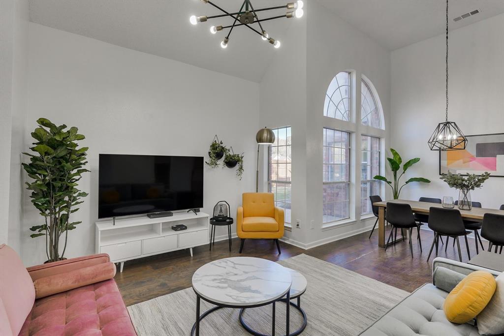 4402 Goodwin Drive Grand Prairie, TX 75052 - Photo 11 of 39 a living room with furniture and a flat screen tv