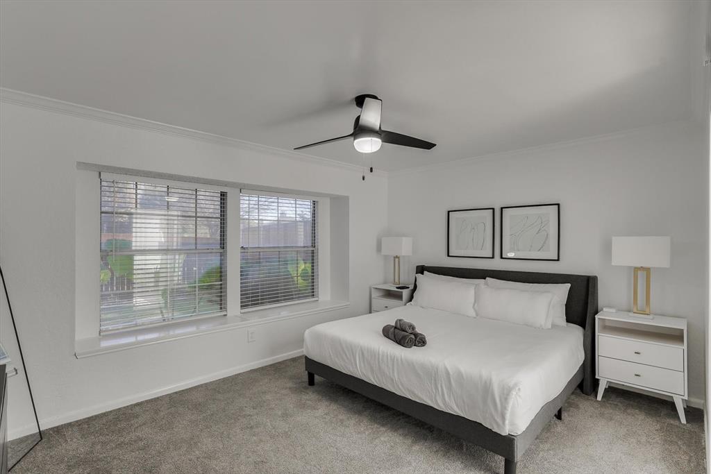 4402 Goodwin Drive Grand Prairie, TX 75052 - Photo 19 of 39 a bedroom with a bed and a window