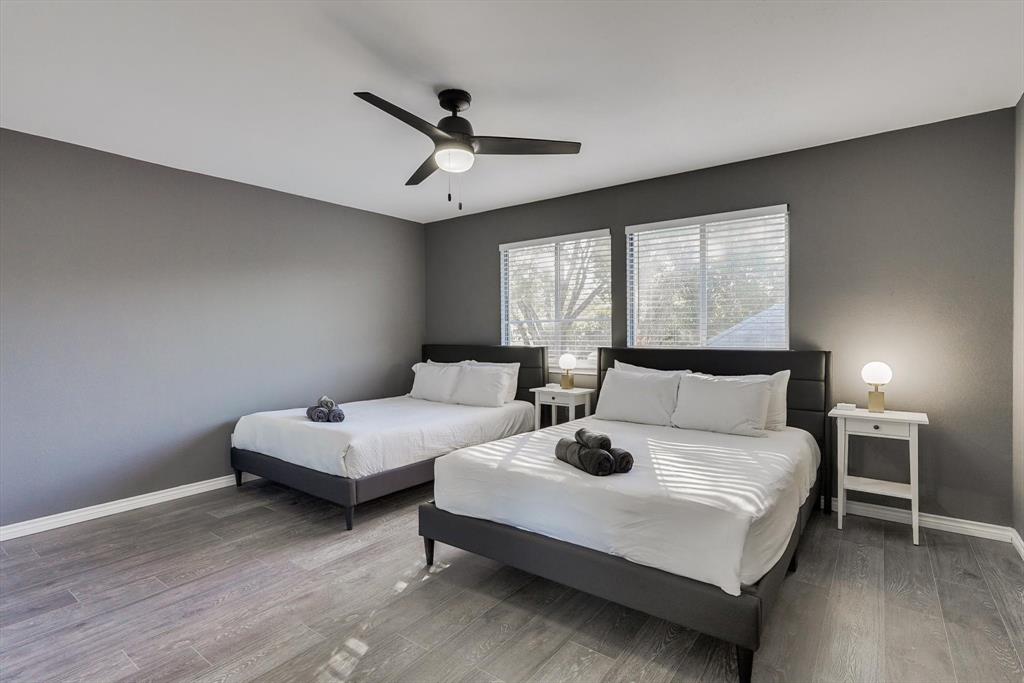 4402 Goodwin Drive Grand Prairie, TX 75052 - Photo 25 of 39 a bedroom with a bed couch and window