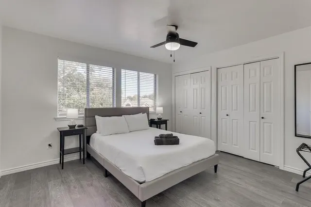 a bedroom with a bed and a table in it