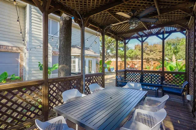 a wooden bench sitting in front of a building