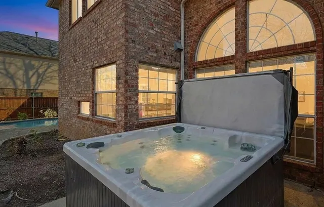 a bathroom with a granite countertop sink and window