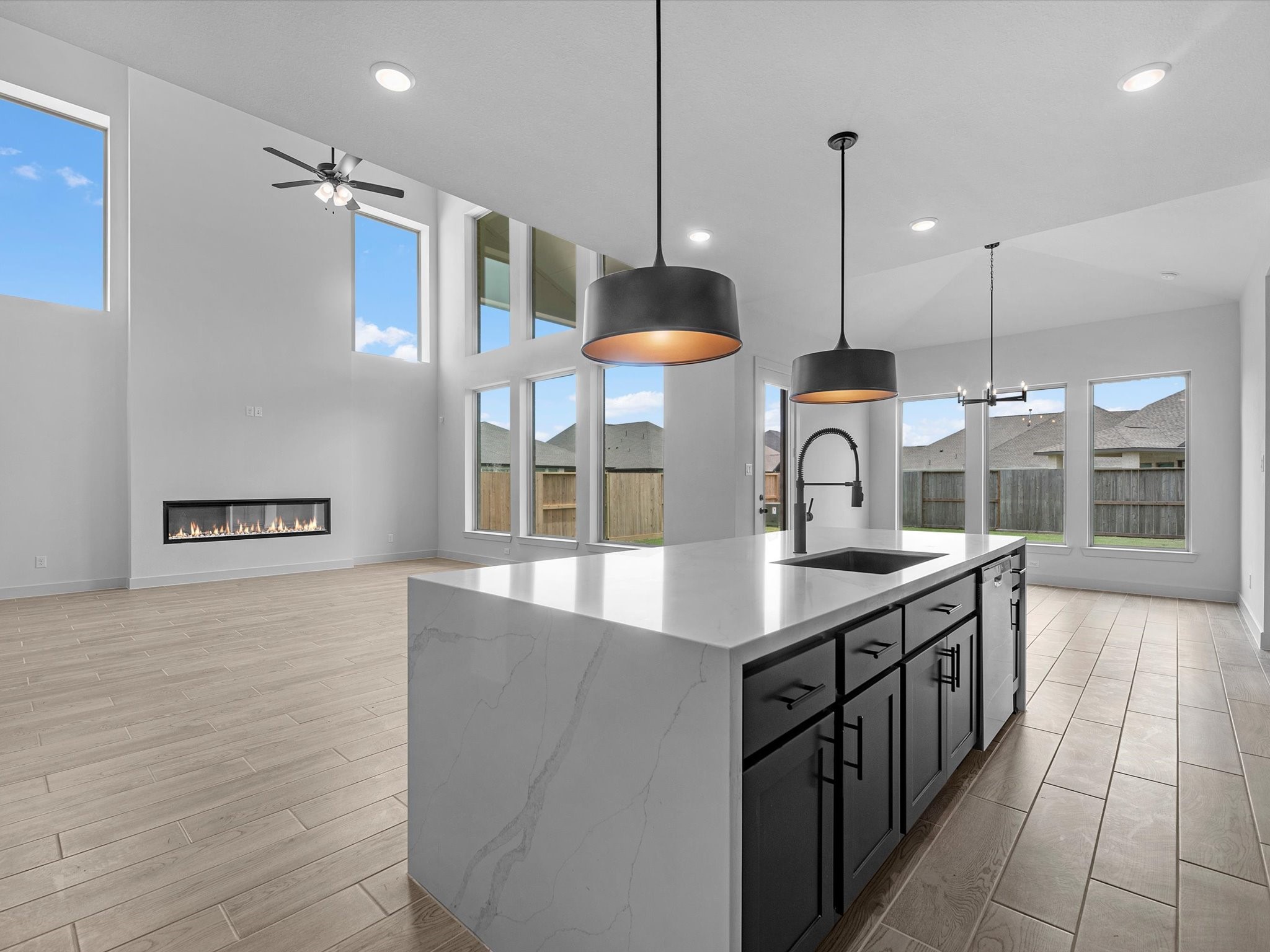 8915 Acropolis Lane Manvel, TX 77578 - Photo 8 of 32 a kitchen with stainless steel appliances granite countertop a sink a counter space a stove and a wooden floors