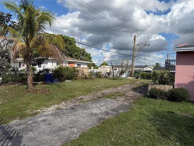 a view of a park with swings and slides