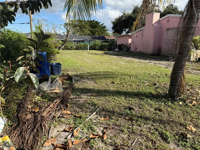a view of a yard with an outdoor space