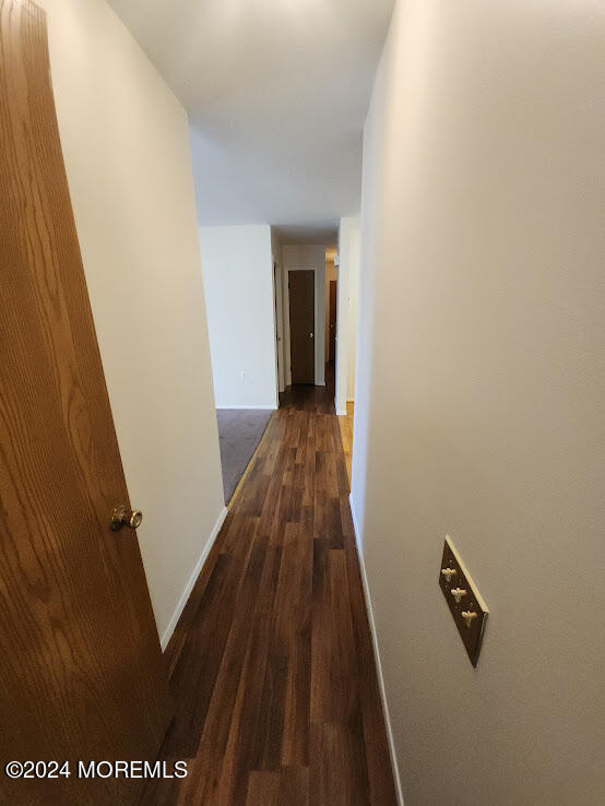 44B Stonybrook Road, Unit C Whiting, NJ 08759 - Photo 9 of 29 a view of a hallway with wooden floor and staircase