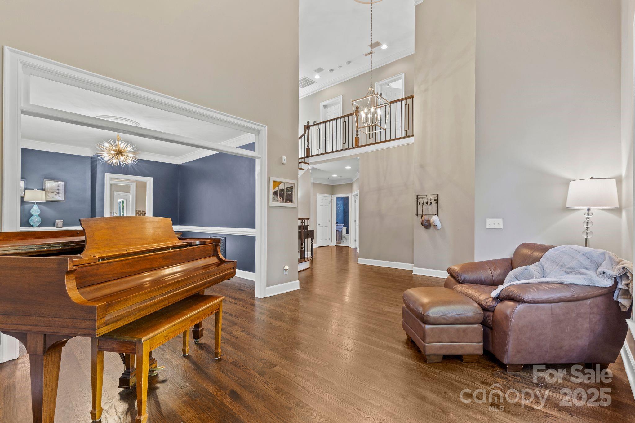 17701 Springwinds Drive Cornelius, NC 28031 - Photo 11 of 48 a living room with furniture and a wooden floor
