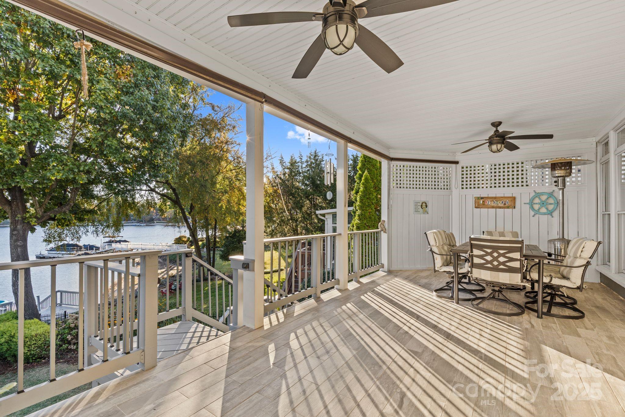 17701 Springwinds Drive Cornelius, NC 28031 - Photo 26 of 48 a view of a chairs and table in patio with wooden floor